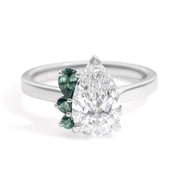pear-diamond-platinum-engagement-ring-with-teal-green-pear-accent-stones-in-a-half-halo-cluster