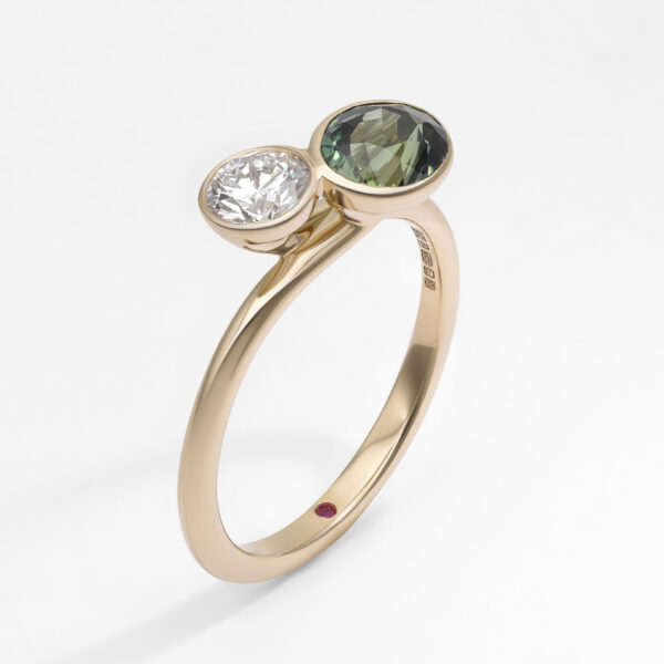 toi-et-moi-engagement-rings-round-diamond-round-green-sapphire-yellow-gold-bezel-set